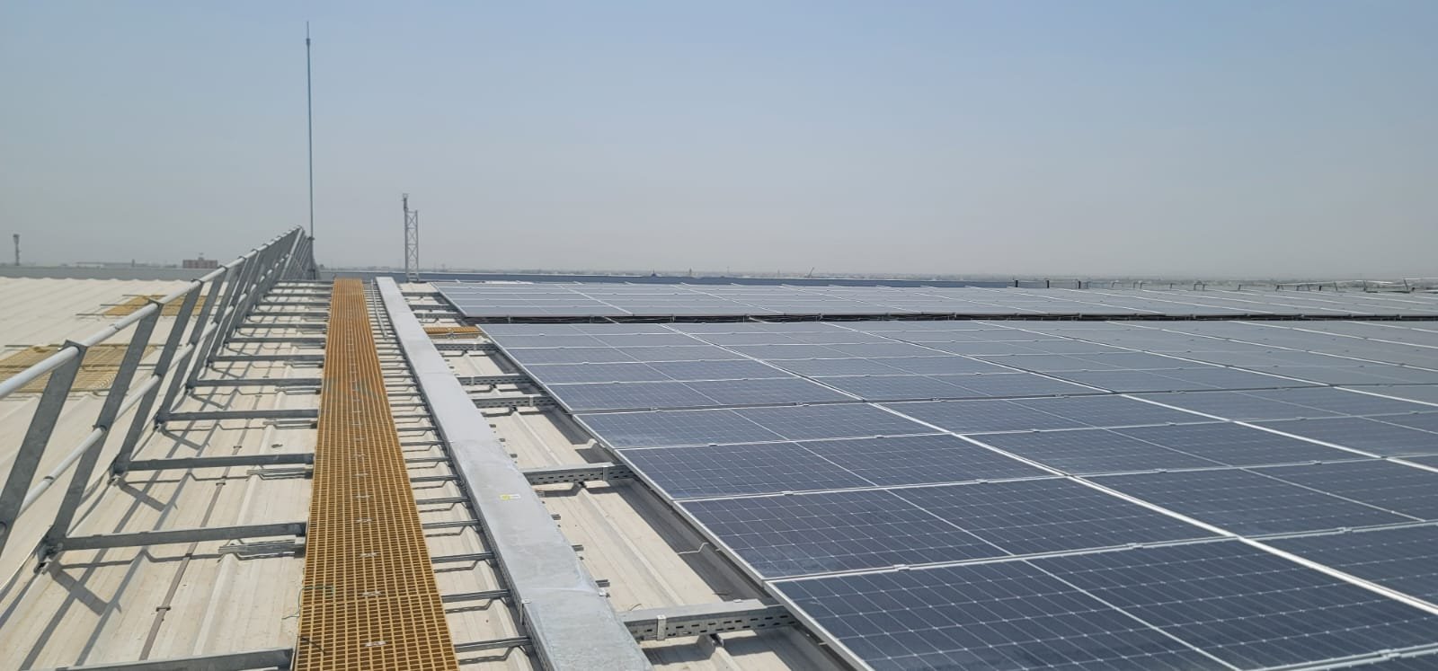 Rooftop solar array with walkway and safety railing, ILS Barka